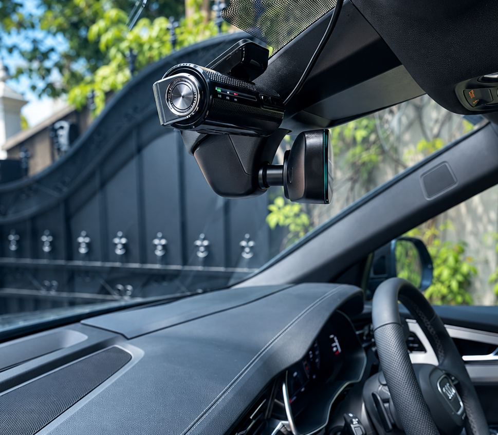 Dashcam neatly mounted behind a rear-view mirror